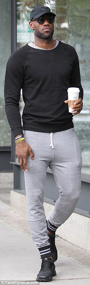 Sporty: James teamed his tight top with grey sweatpants and a pair of trainers