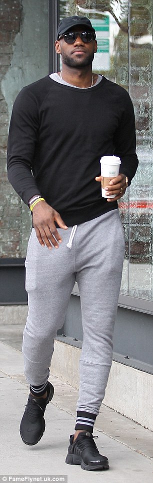 Sporty: James teamed his tight top with grey sweatpants and a pair of trainers