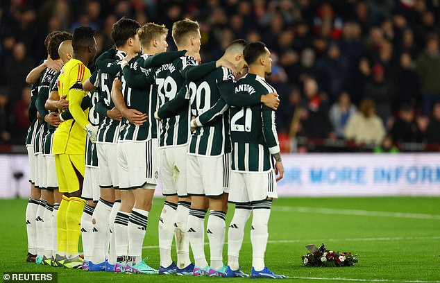 Manchester United's team line up to pay their respects to the former club director and player