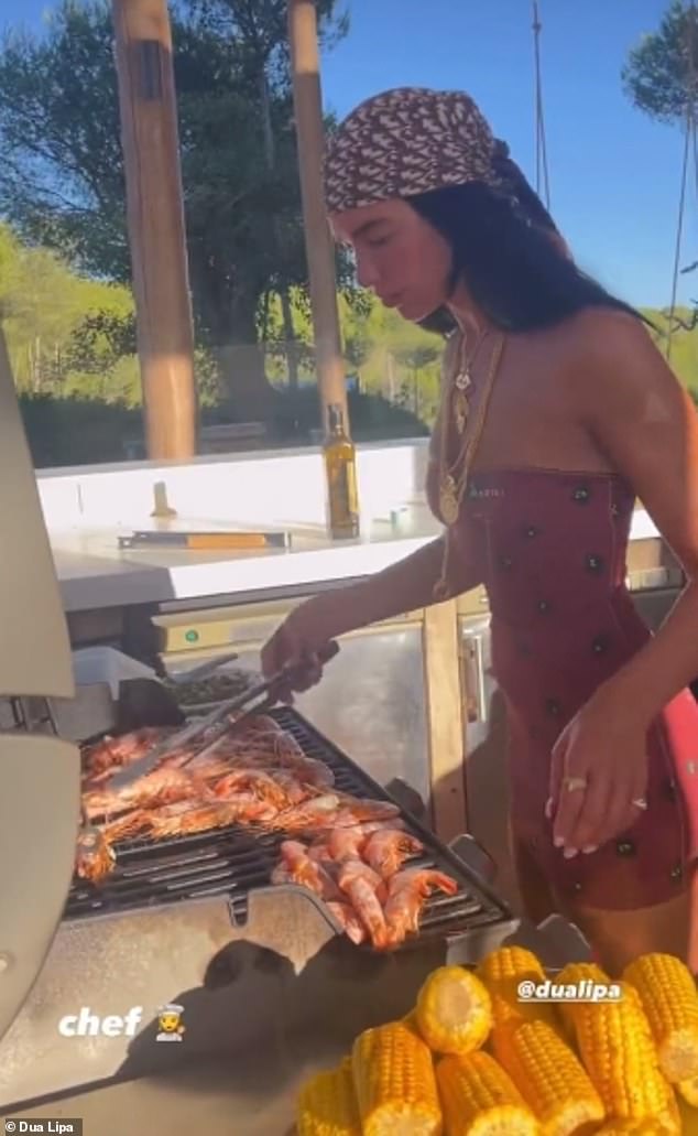 Oh dear! Dua Lipa fans notice a huge mistake the singer made whilst 'cooking' shrimp during a holiday