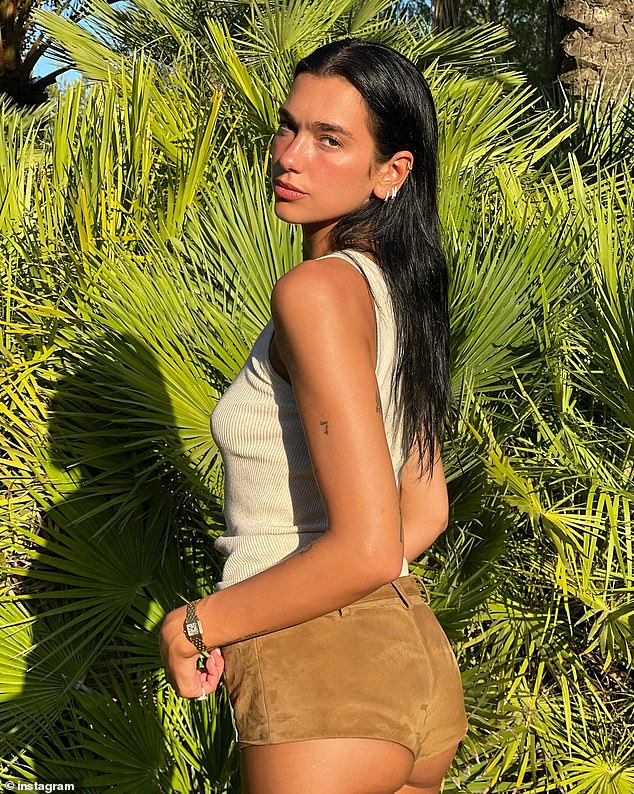Short shorts: Dua Lipa showed off her incredibly toned backside in a pair of very short shorts