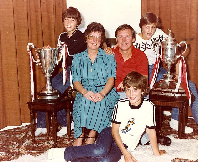 Alex, Cathy and their three sons, Mark, Darren and Jason, with the European Cup Winners Cup and the Scottish Cup