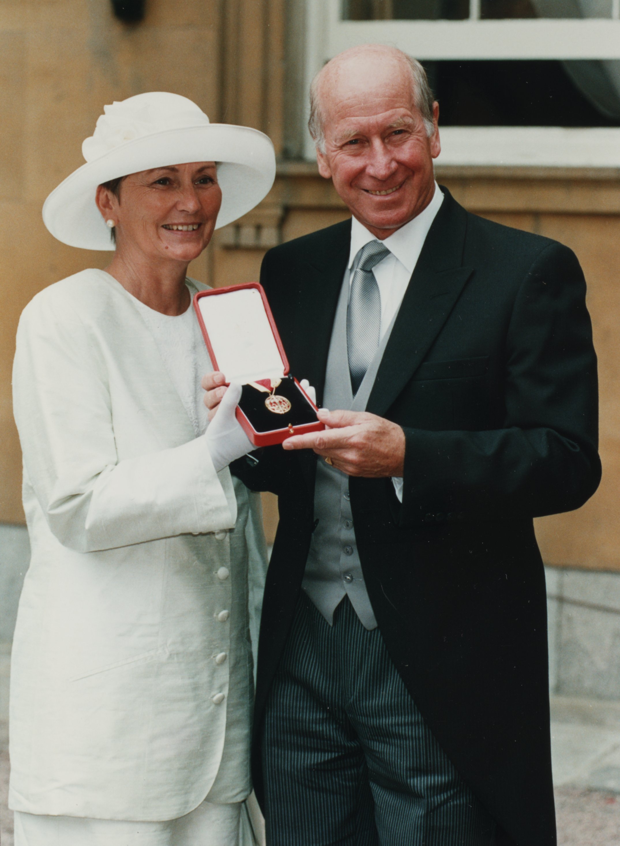 Norma accompanied Bobby to Buckingham Palace when he was knighted in July 1994