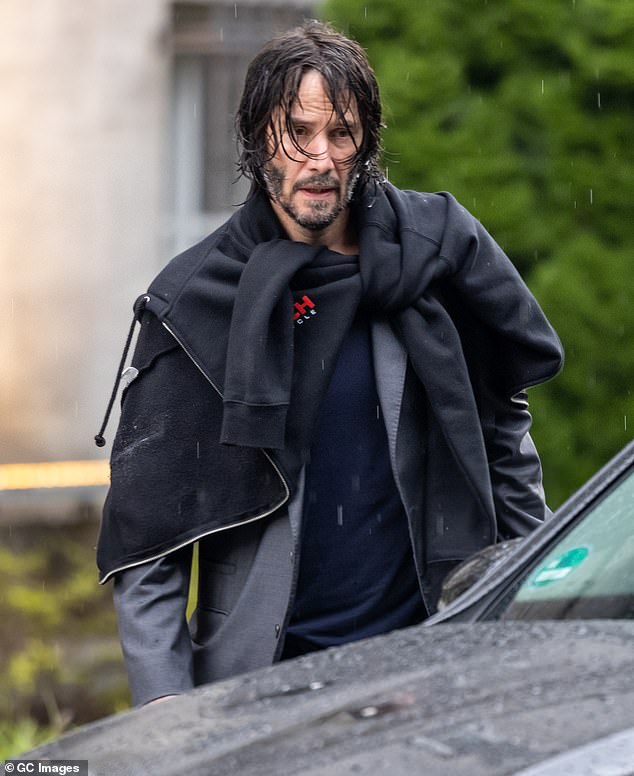 Low-key: Keanu Reeves, 56, cut a laid-back figure as he exited his hotel in Berlin to resume work on the action blockbuster on Thursday