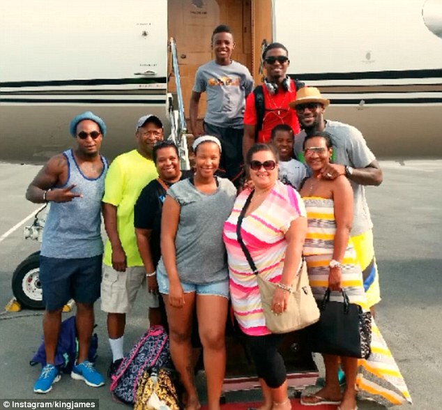 Getaway: James is on holiday with his NBA future also up in the air at the moment