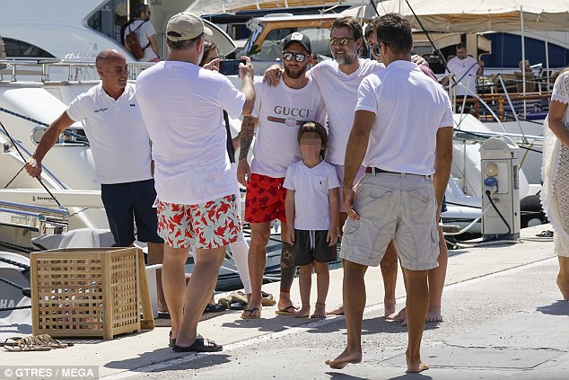Messi took time out of his day to pose for photos with delighted supporters in Ibiza