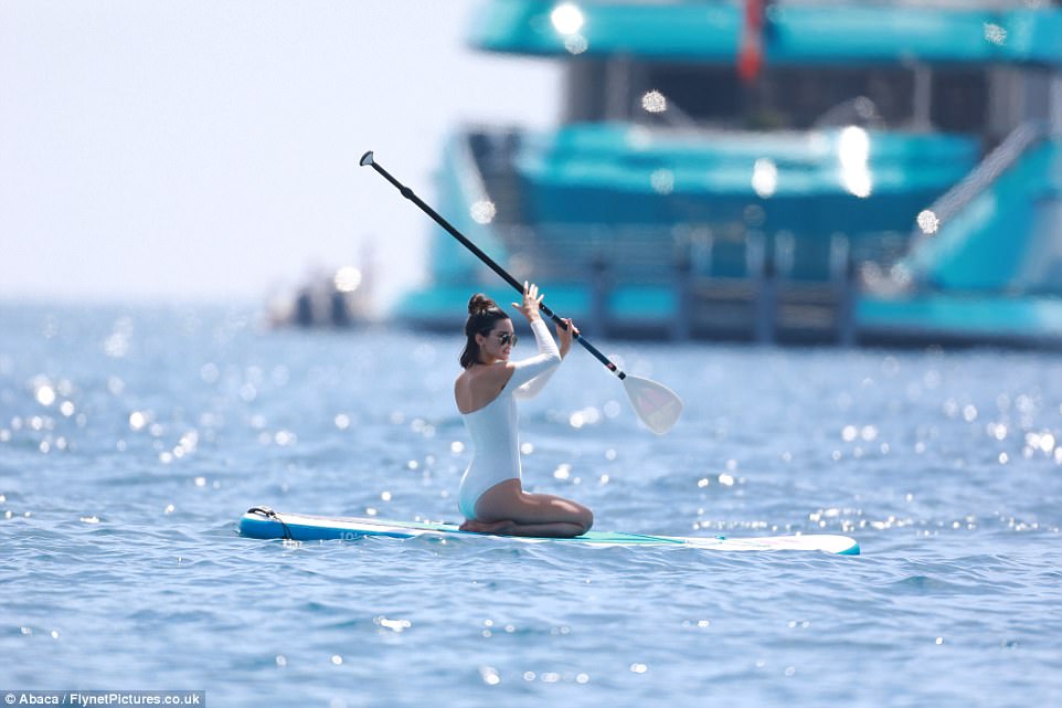 Put your back into it! Opting for a bit of exercise she used the paddle to make her way along the waves