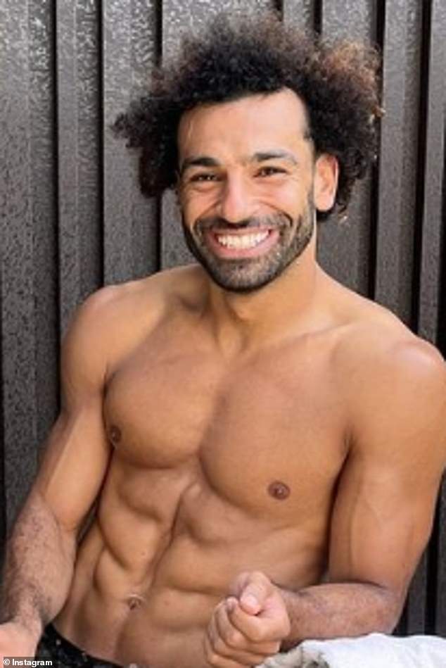 Muscle power: The Egyptian-born hunk, 31, showed off his chiselled chest for the camera and flashed a beaming smile as he braced the chilly temperature