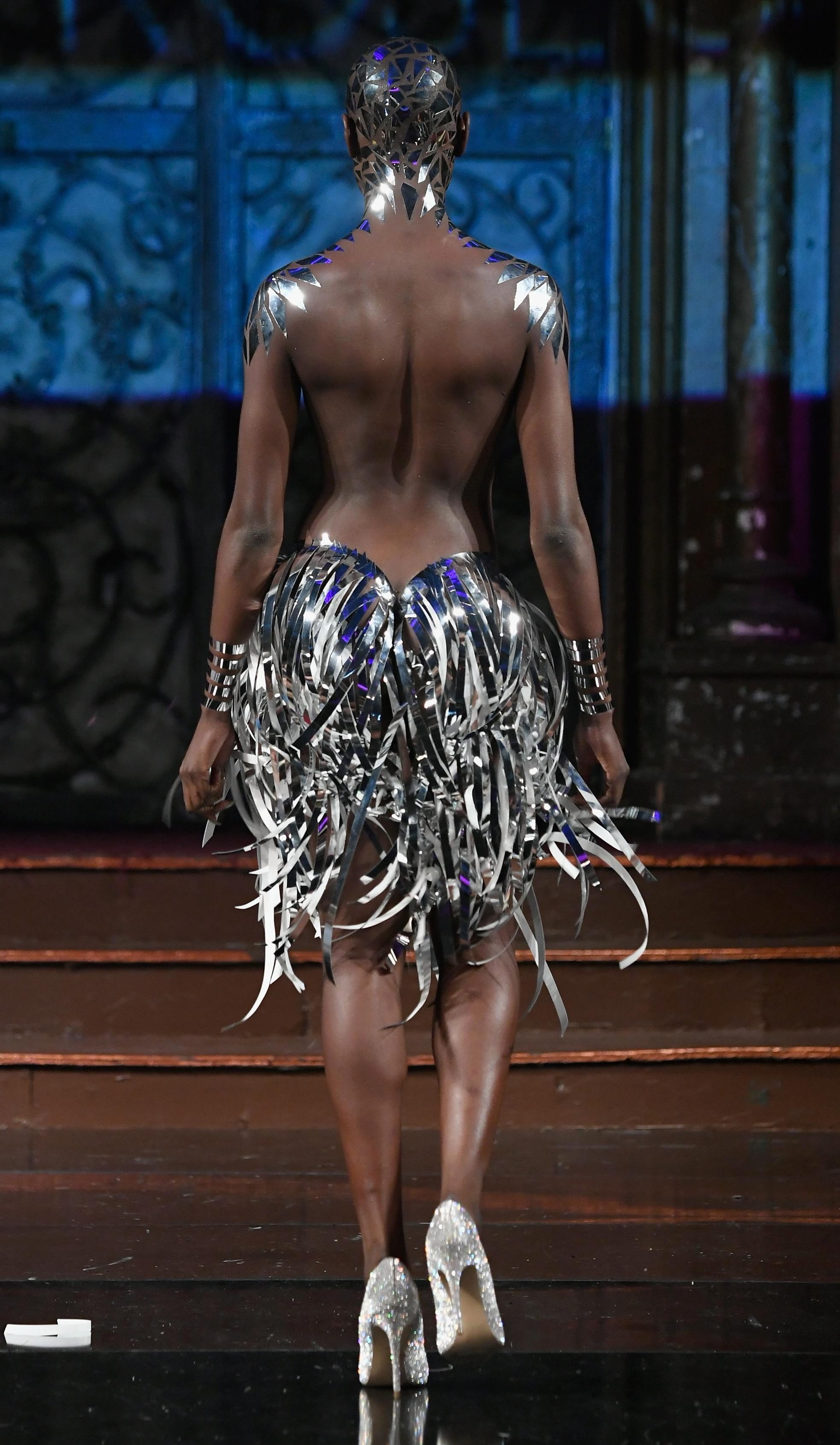  We're not sure how we feel about glittery duct tape skirts... not to mention the silver stripe headpiece