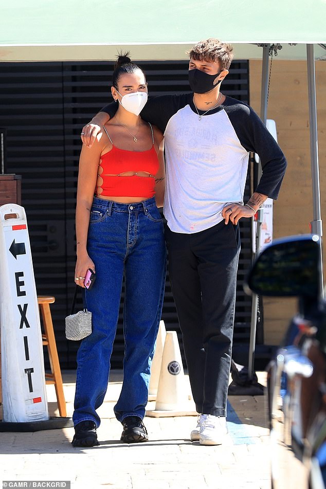 Outing: Dua Lipa showed off a glimpse of underboob in daring red cut-out top after enjoying a lunch date with beau Anwar Hadid at Nobu in Malibu, California, on Sunday