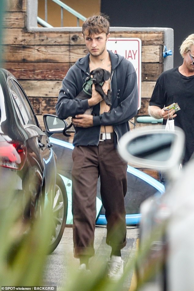 Cute! Earlier in the day her beau Anwar, 21, was seen out in Malibu with the couple's puppy Dexter